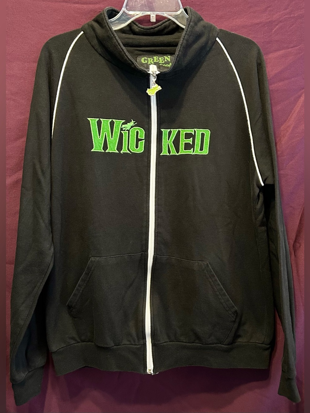 Wicked the Musical Black Cowl Zip Sweater with Green Logo and Shaped Zipper Pull